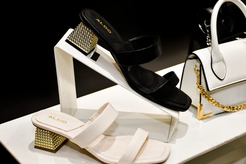 Elegant display of Aldo sandals and bag featuring modern fashion design.