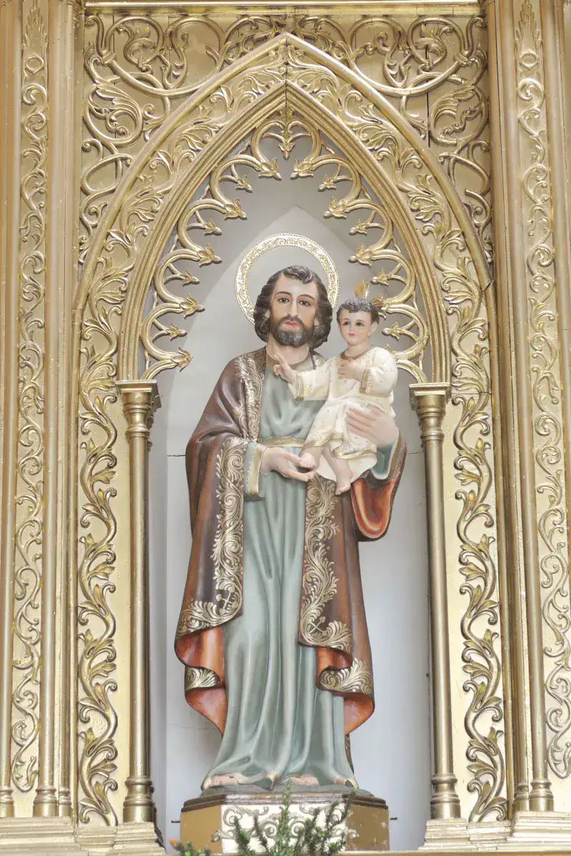 Intricate statue of Jesus and Saint Joseph inside a church in Ecuador.