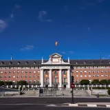Front view of the iconic Ejército del Aire building in Madrid, Spain, with a clear blue sky.