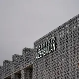 Contemporary geometric facade with 'Azerbaijan' text in Osaka, Japan, capturing modern architectural design.