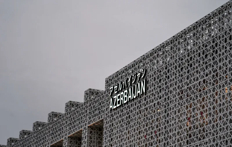Contemporary geometric facade with 'Azerbaijan' text in Osaka, Japan, capturing modern architectural design.