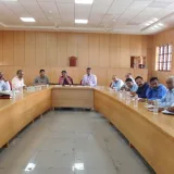 A group of men are having a meeting