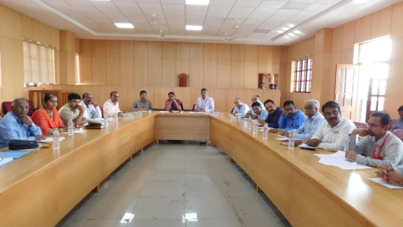 A group of men are having a meeting