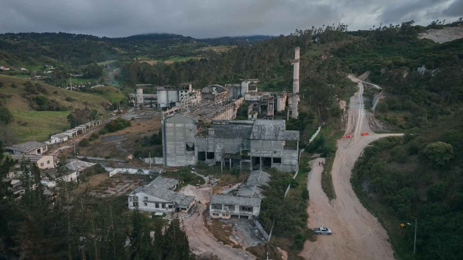 Drone shot of abandoned buildings surrounded by nature in Bogotá, Colombia.
