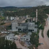 Drone shot of abandoned buildings surrounded by nature in Bogotá, Colombia.