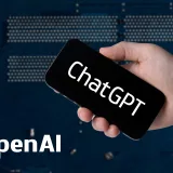 File:Hand holding smartphone with ChatGPT and OpenAI text (52917312010).jpg