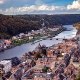 Breathtaking aerial view of Dinant with the Meuse River winding through Wallonia, Belgium.