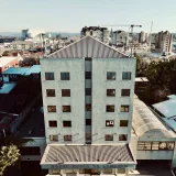 Aerial shot of Hotel Diego de Almagro in the cityscape of Valdivia, Chile, during daytime.
