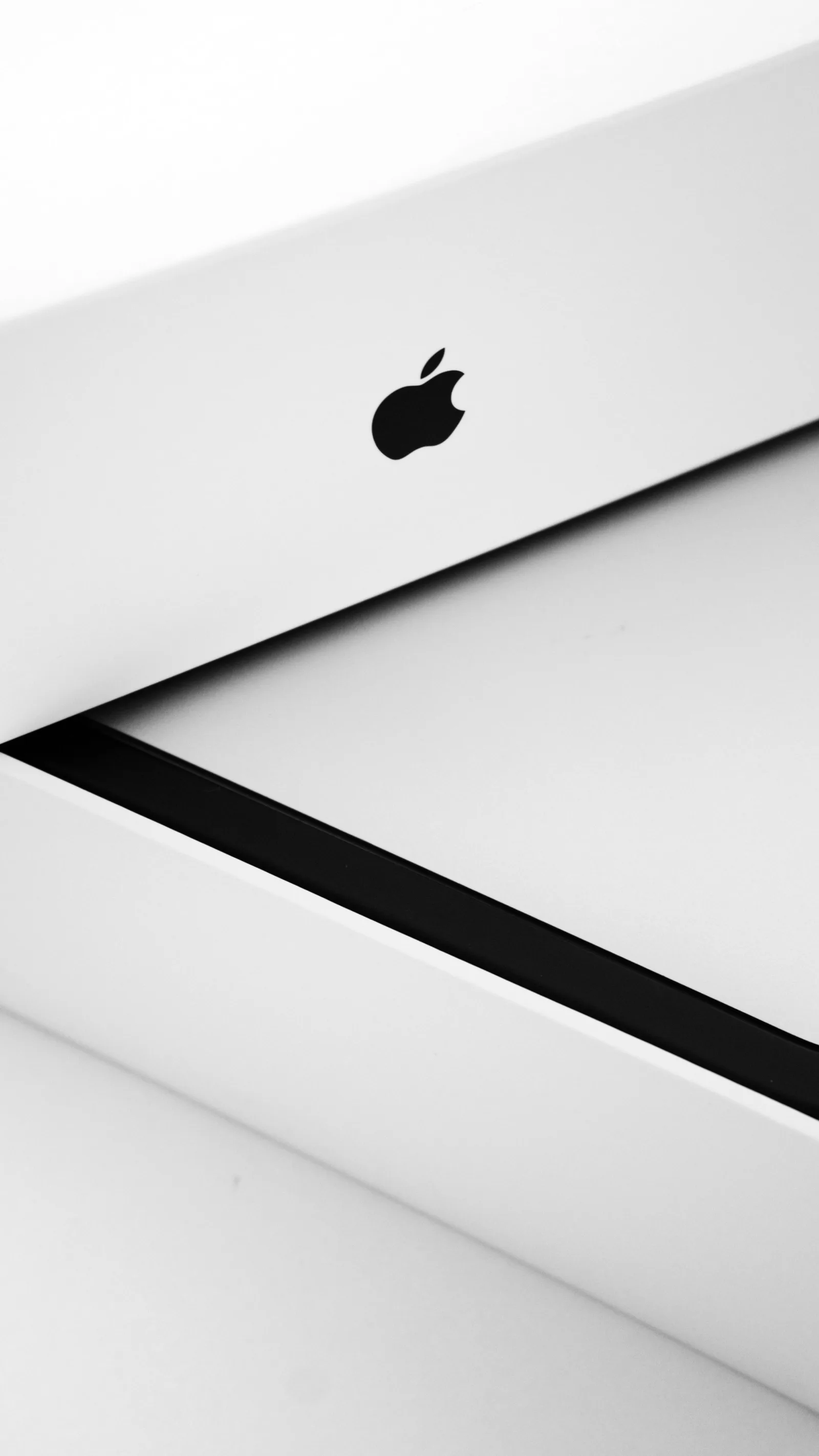 Imagen en primer plano que muestra el elegante diseño del empaque de un producto Apple. Ideal para temas minimalistas.