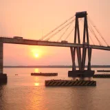 Scenic sunset over General Manuel Belgrano Bridge, reflecting on the Paraná River, in Corrientes, Argentina.