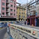 A vibrant urban street scene in Santiago, Chile showcasing graffiti art and architecture.