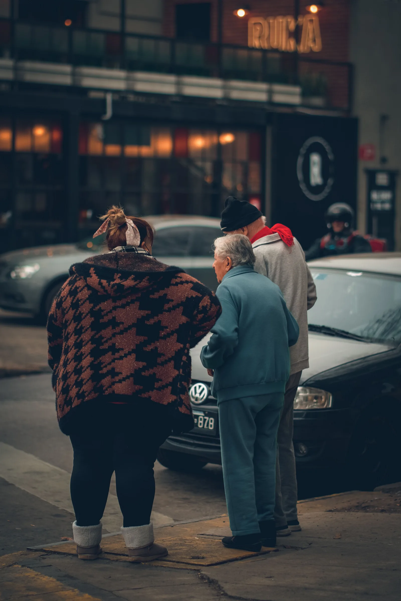 People gather on a city sidewalk in Adrogué, Buenos Aires, Argentina.
