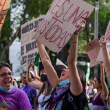 Women rally in Ciudad de México, expressing unity and strength with placards and chants.