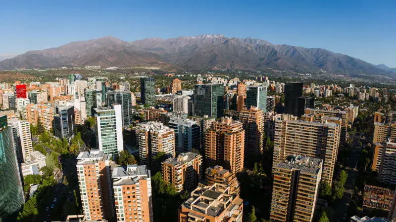 Aerial view of Santiago de Chile skyline with the Andes Mountains in the background.