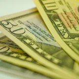 Macro shot of American dollar bills displaying currency detail for finance-related concepts.