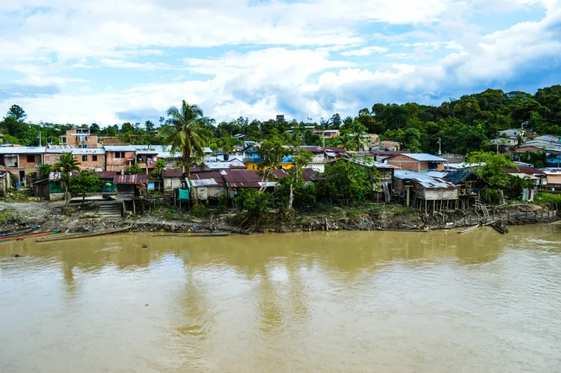 Aerial view of the rural riverside town of Puerto Nuevo, Chocó, Colombia.