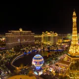 Stunning nighttime aerial view of the Las Vegas Strip featuring the Eiffel Tower replica.