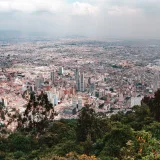 Stunning aerial view of Bogotá, Colombia, showcasing its vibrant urban landscape and surrounding greenery.