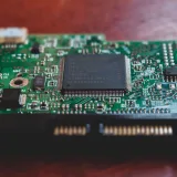 Detailed close-up of a green electronic circuit board, highlighting technology components. Shot in Mérida, Venezuela.