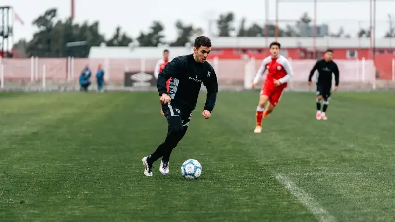 Dynamic capture of a soccer player dribbling during a competitive match.