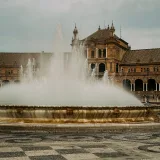 A stunning view of the Plaza de España fountain in Seville, Spain, capturing its architectural grandeur and elegance.