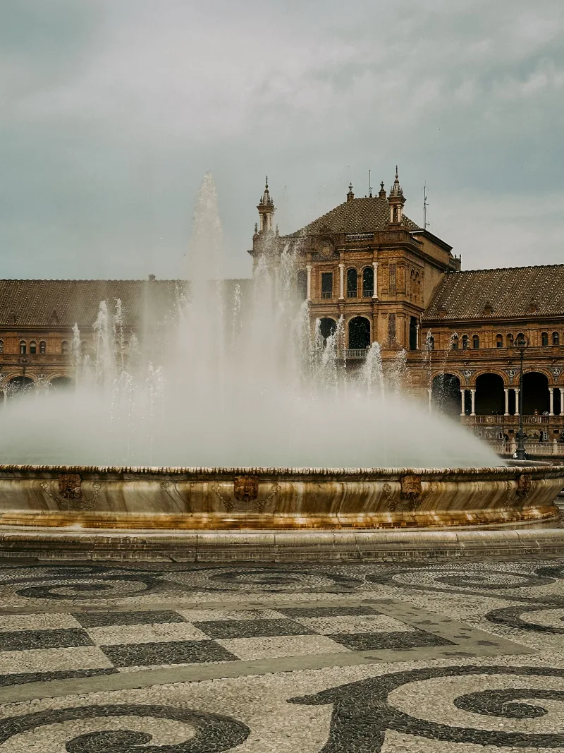 A stunning view of the Plaza de España fountain in Seville, Spain, capturing its architectural grandeur and elegance.