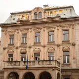 Explore the historic charm of classic Balkan architecture in Bosnia with this vintage building facade.