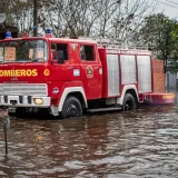 A fire truck drives through a flooded street in Buenos Aires, Argentina, during a storm.