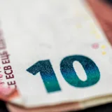 Detailed close-up of a ten euro banknote highlighting currency design and texture.