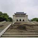 Majestic view of Dr. Sun Yat-sen's Mausoleum surrounded by greenery in Nanjing.