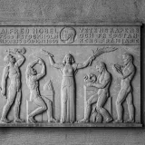 Black and white relief artwork honoring Alfred Nobel in Stockholm City Hall, Sweden.