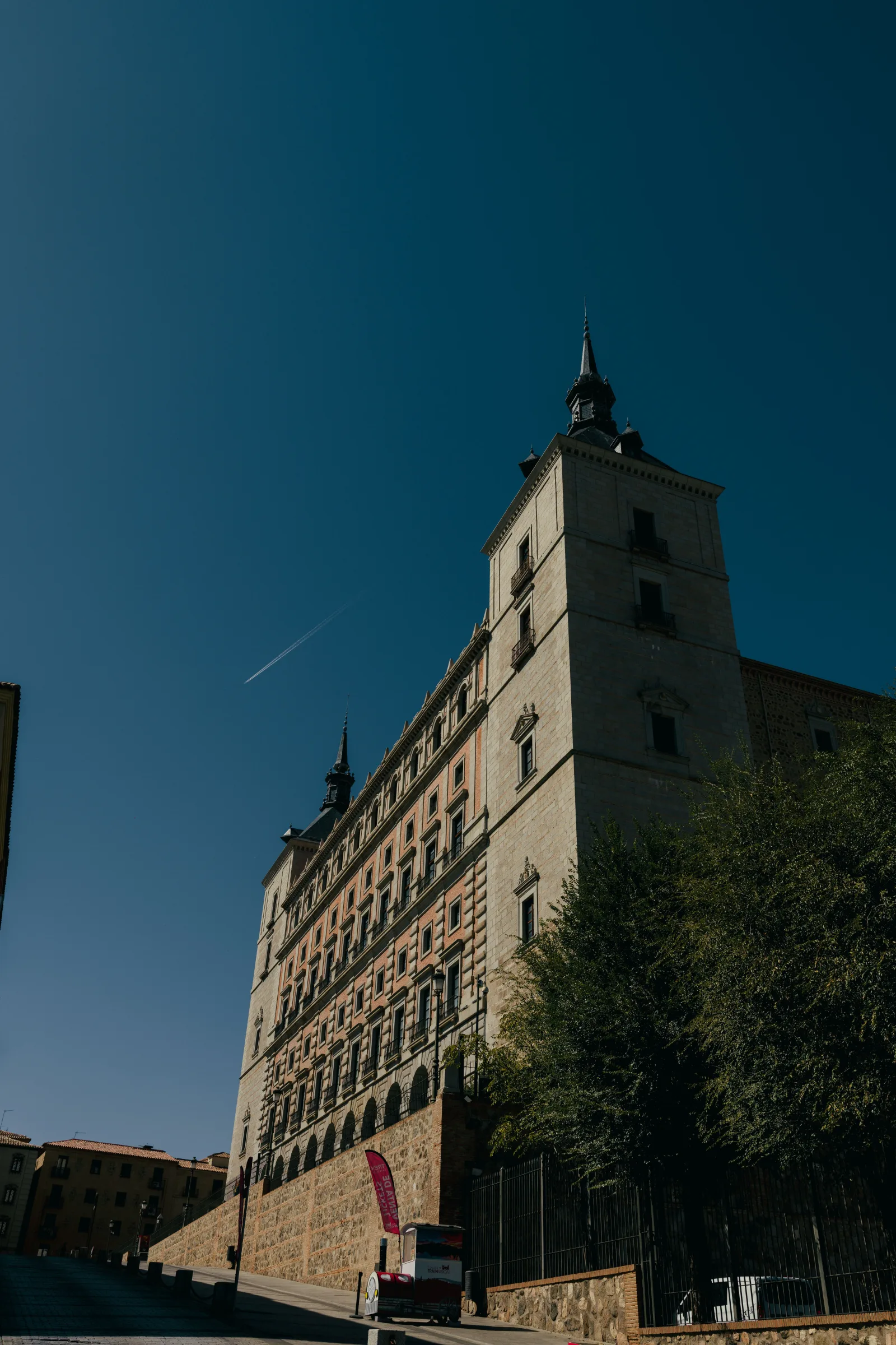 A view of the Alcázar in Toledo, Spain on a sunny day showcasing its architectural grandeur.