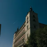 A view of the Alcázar in Toledo, Spain on a sunny day showcasing its architectural grandeur.