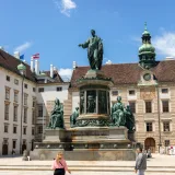The Francis II statue in Vienna's Hofburg Palace courtyard on a sunny day.