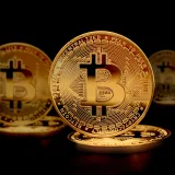 Close-up of golden Bitcoin coins symbolizing digital currency and modern finance.