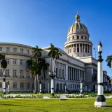 Scenic view of the El Capitolio framed by palm trees in Havana, Cuba.