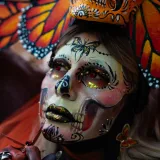 Vibrant face painting inspired by Dia de los Muertos in Mexico City.