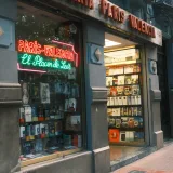 Exterior view of Librería París Valencia with books on display, inviting entrance.