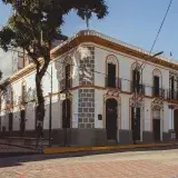 Beautiful colonial architecture with bright sunlight in Mérida, Venezuela capturing the essence of South American heritage.