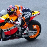 MotoGP racer speeding on track at Sepang International Circuit in Malaysia.