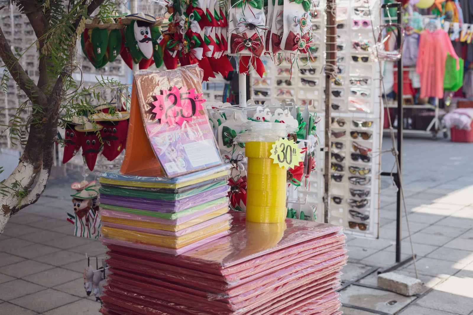 Vibrant market stall in Ciudad de México selling craft supplies and festive decorations.