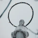 Elegant statue with halo, embodying spiritual art in León, Nicaragua. Captivating and inspiring with a serene presence.